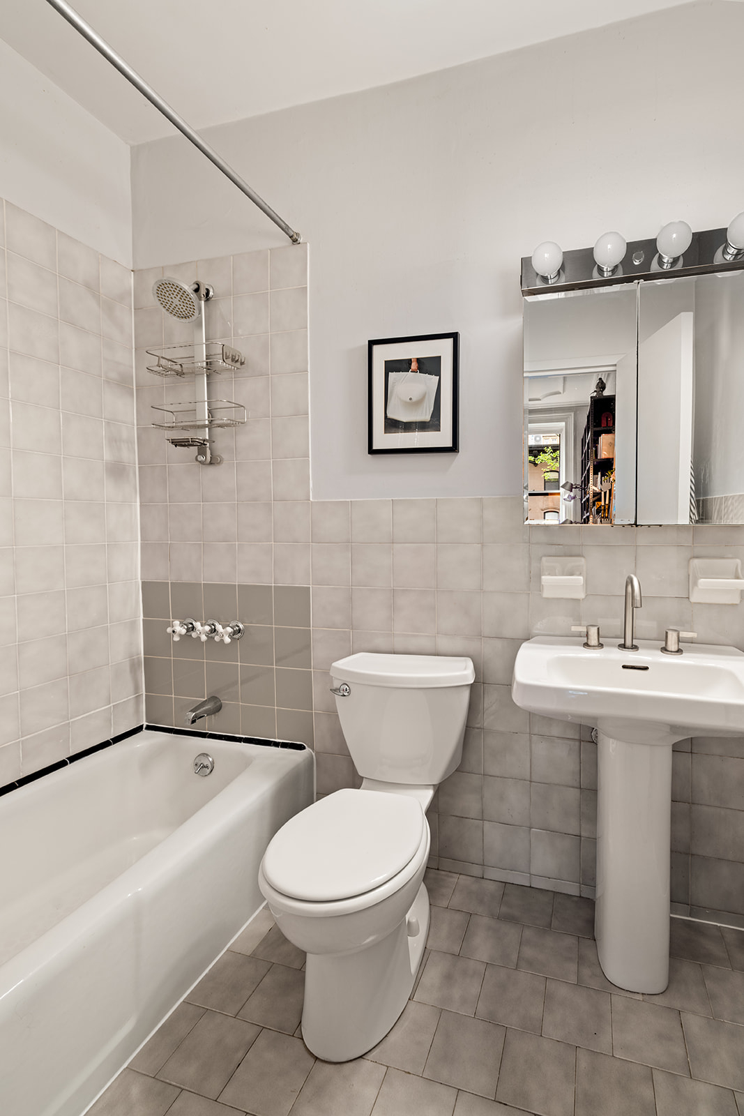 21 South Portland Avenue, Unit 2F Brooklyn, NY 11217 - Photo 4 of 8 a bathroom with a toilet a sink and bathtub