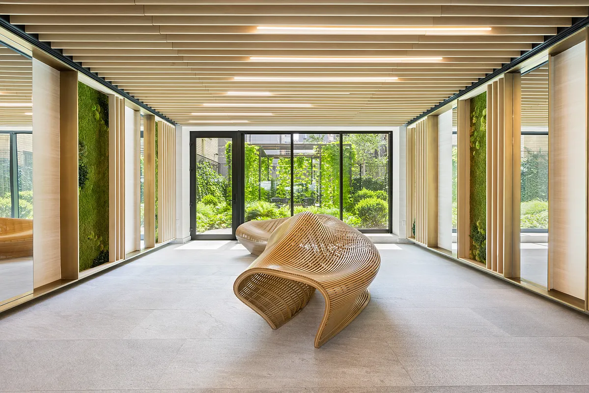 85 4th Avenue, Unit 4EE Manhattan, NY 10003 - Photo 4 of 7 a living room with furniture and a large window
