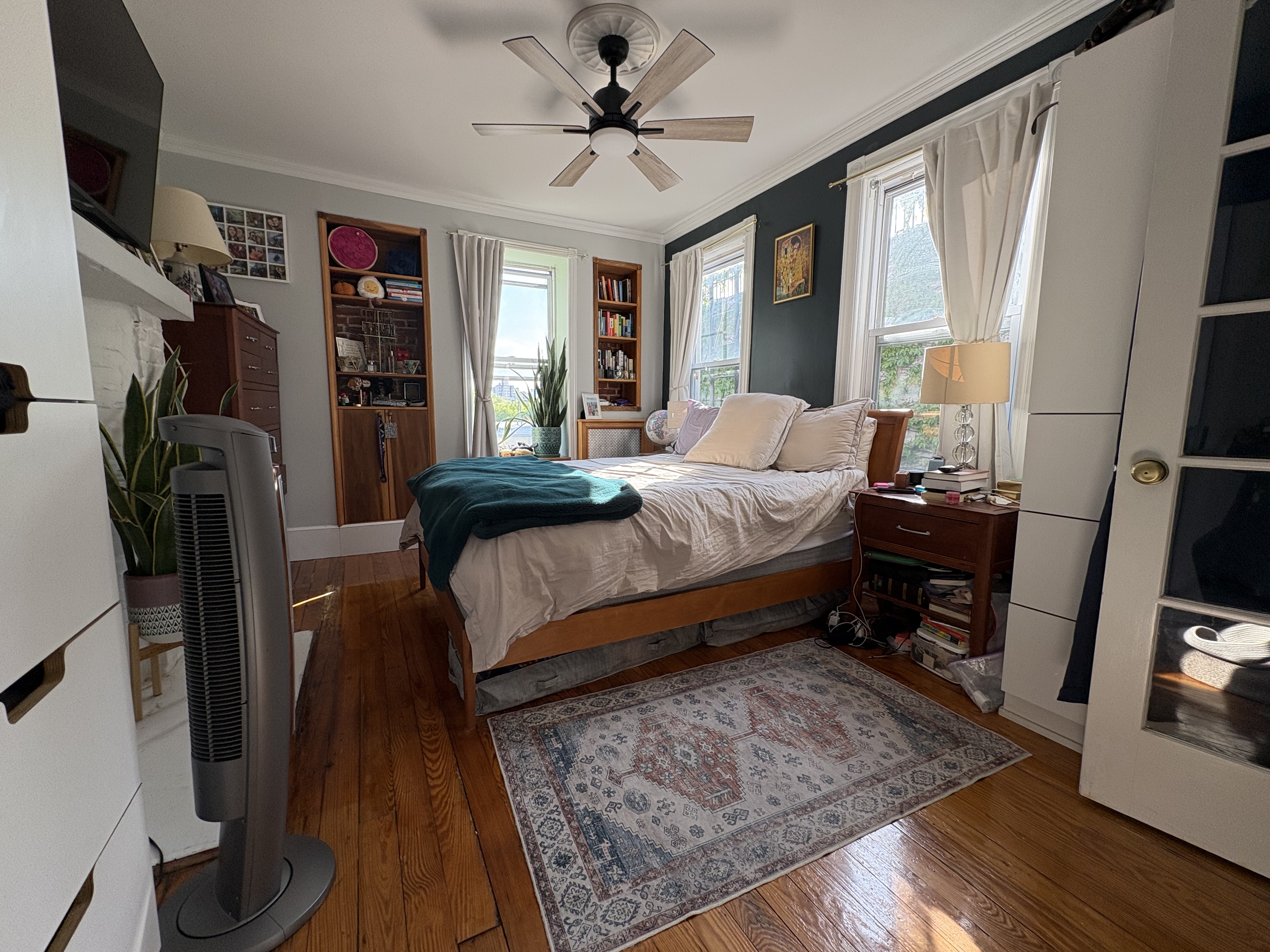 304 7th Avenue, Unit 3 Brooklyn, NY 11215 - Photo 6 of 15 a bedroom with a bed a flat screen tv and a window