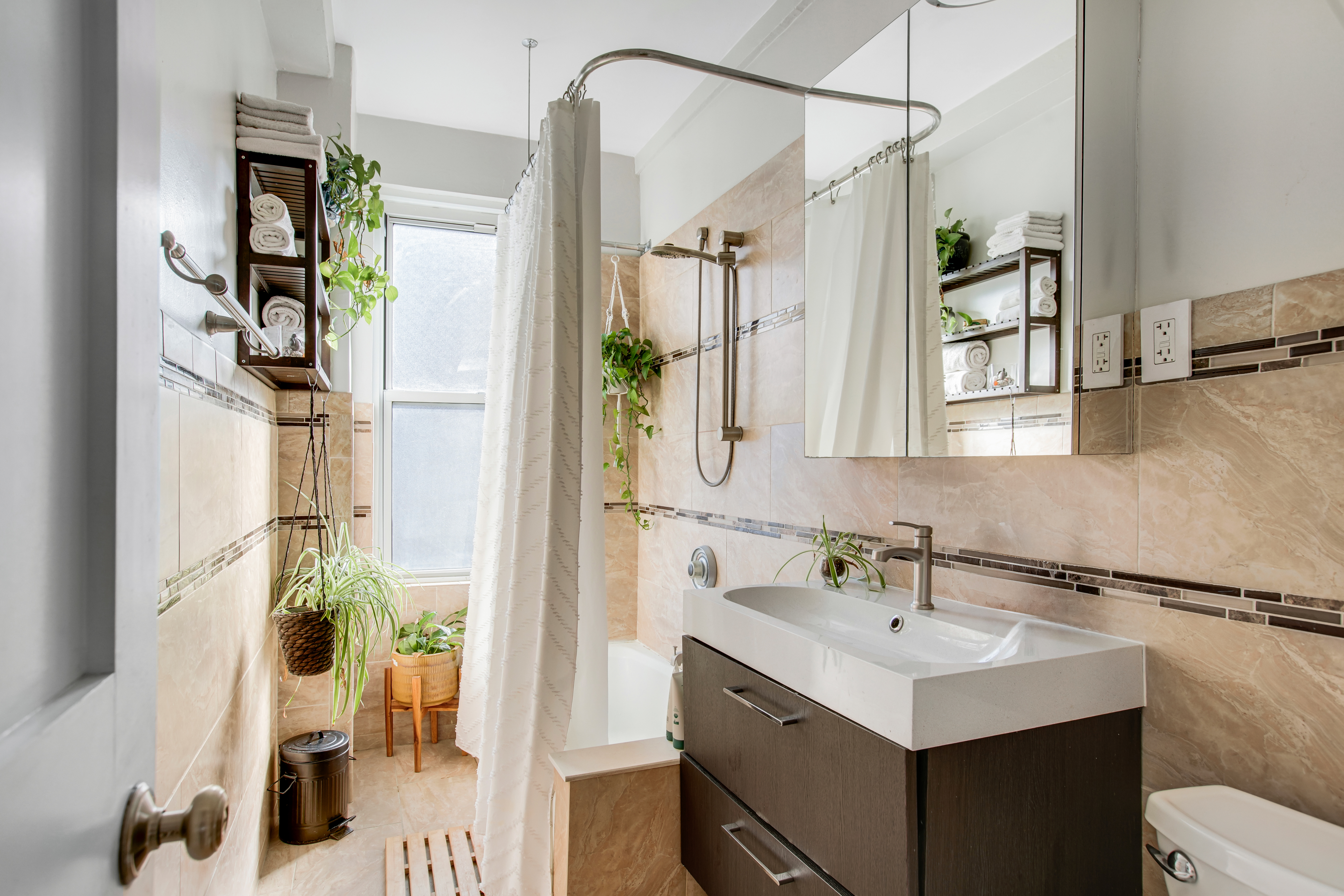 165 West 91st Street, Unit 15B Manhattan, NY 10024 - Photo 12 of 24 a bathroom with a sink vanity toilet and shower