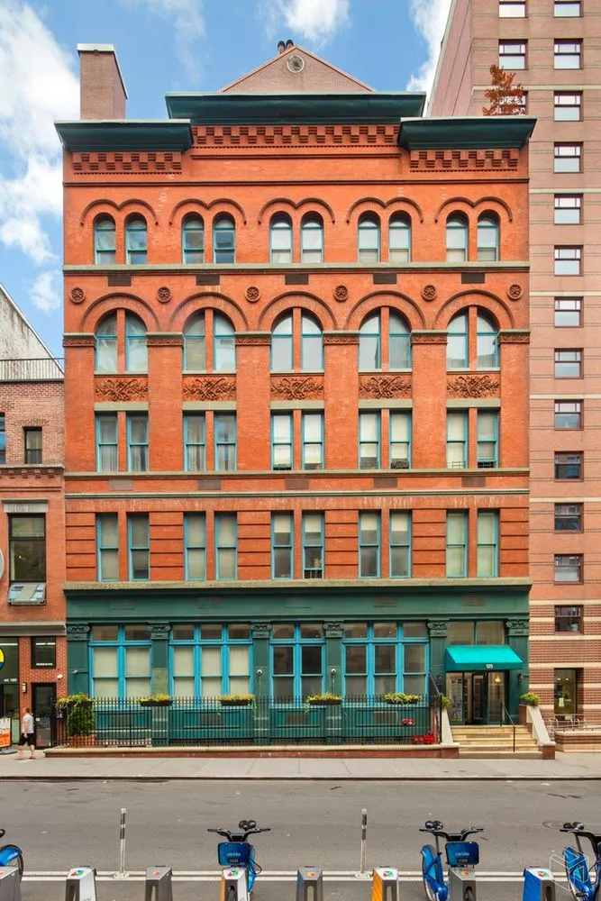 a front view of a building with glass windows