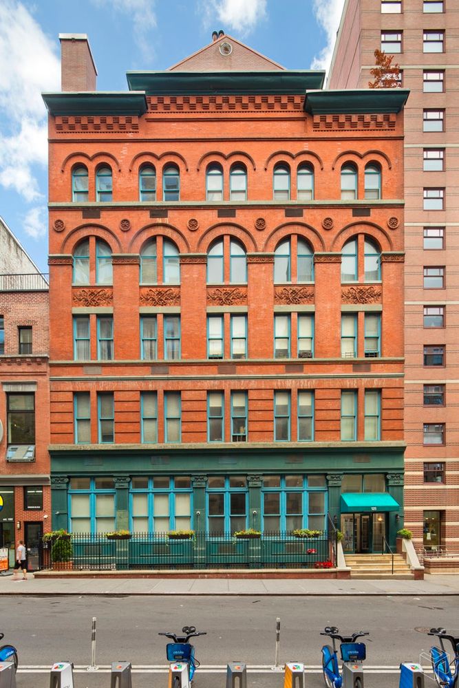 125 East 12th Street, Unit 2G Manhattan, NY 10003 - Photo 10 of 11 a front view of a building with glass windows