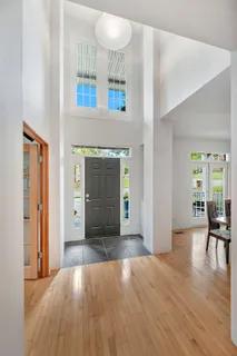 a kitchen with stainless steel appliances granite countertop a sink and a refrigerator