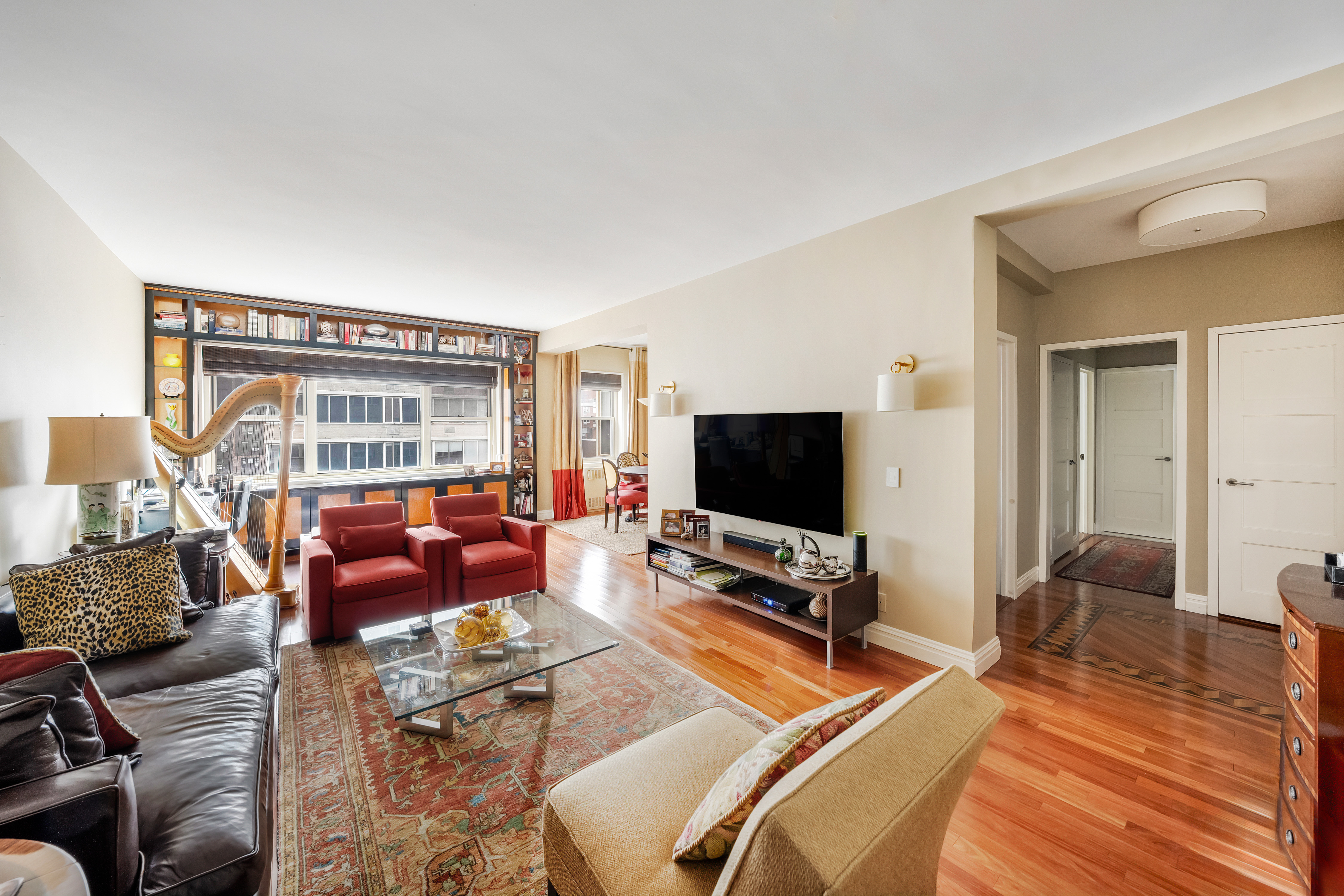 a bedroom with furniture and a flat screen tv