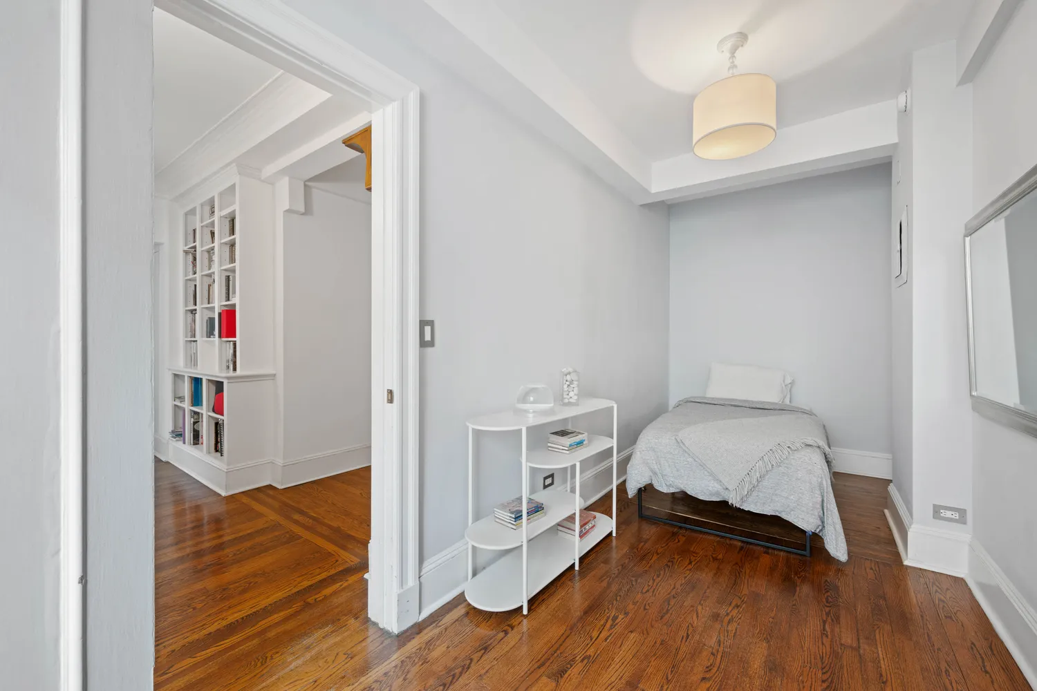 a bedroom with a bed and a closet