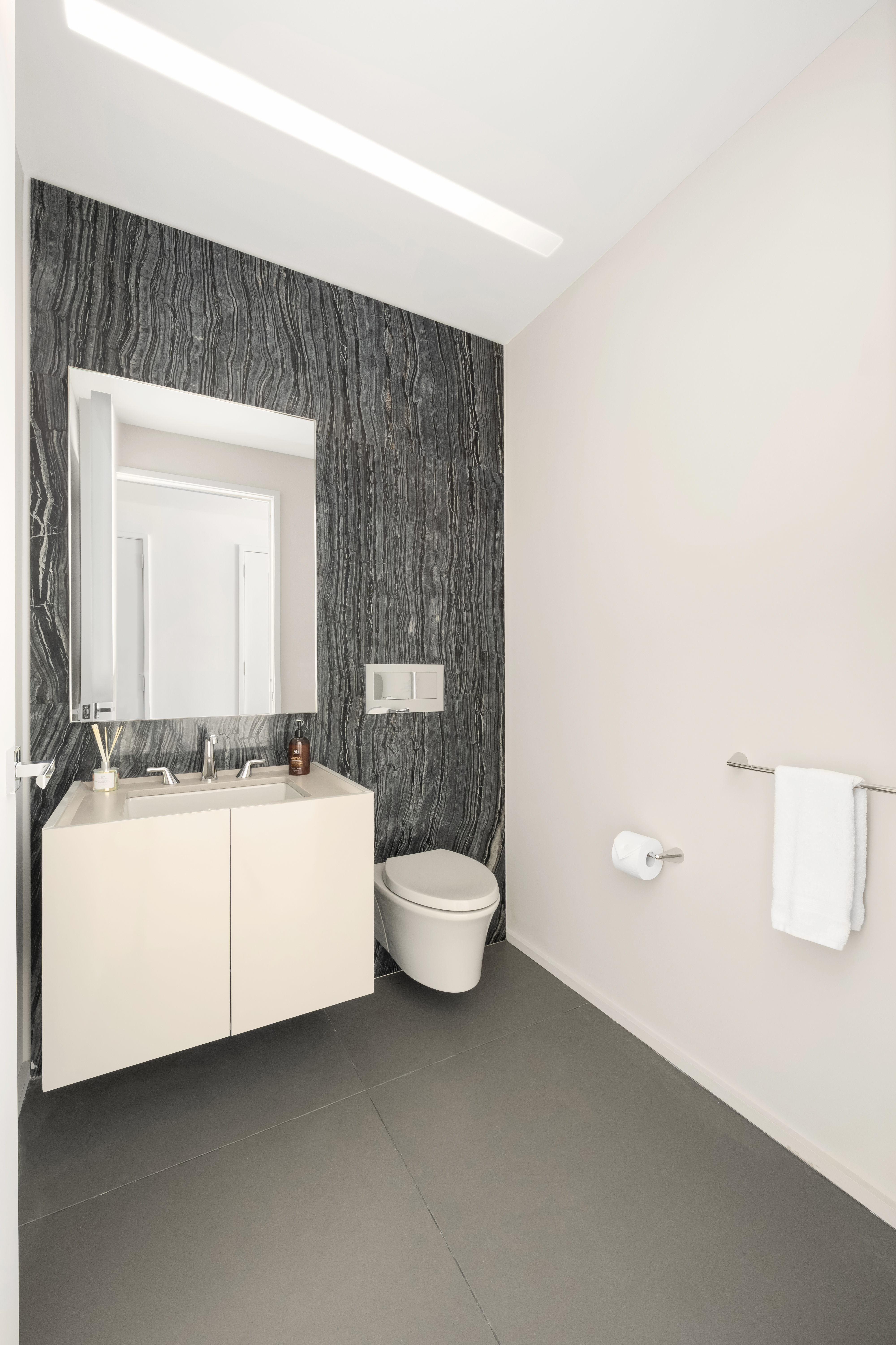 121 East 22nd Street, Unit N1405 Manhattan, NY 10010 - Photo 9 of 19 a bathroom with a toilet a sink and mirror