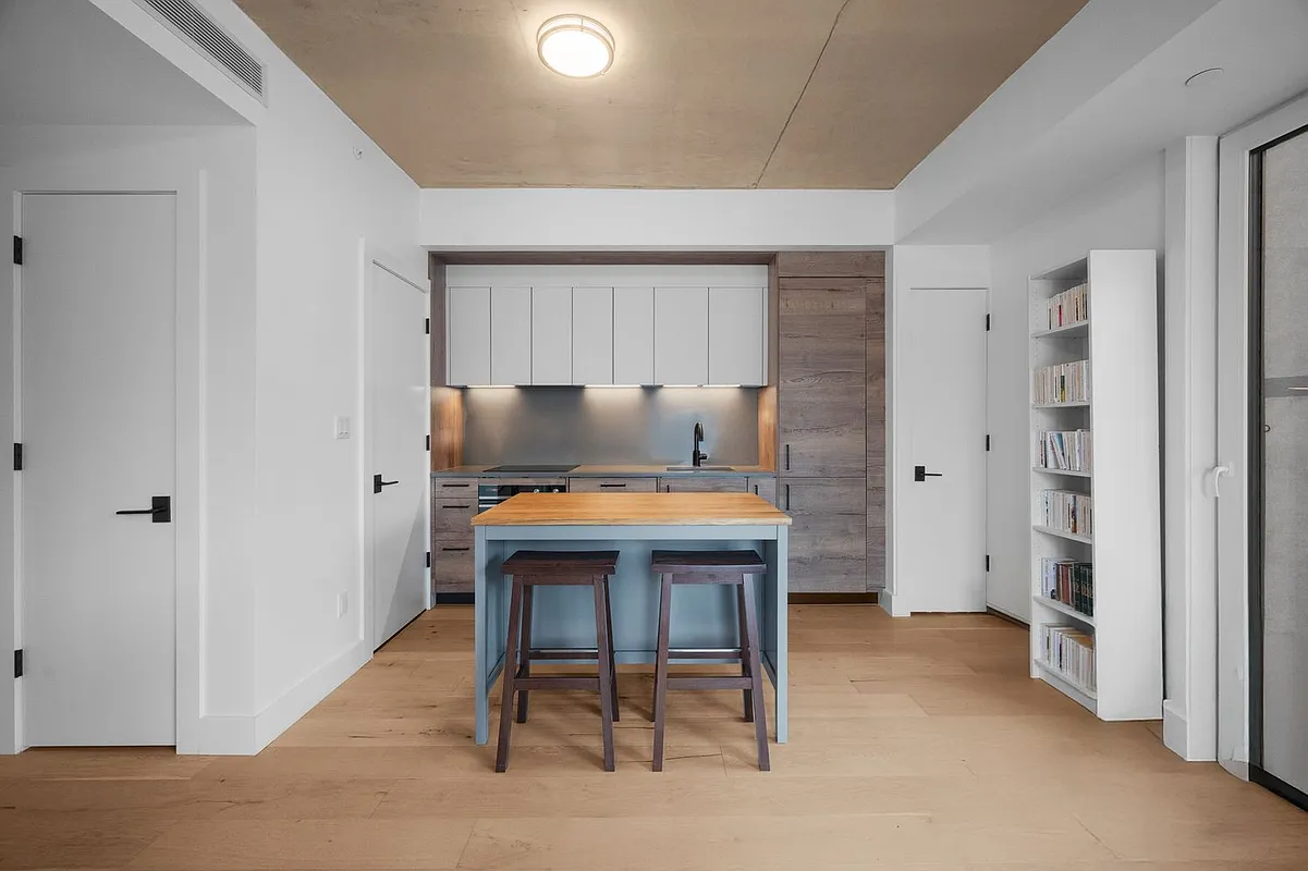 169 Huron Street, Unit 4A Brooklyn, NY 11222 - Photo 5 of 15 a room with a table and chairs