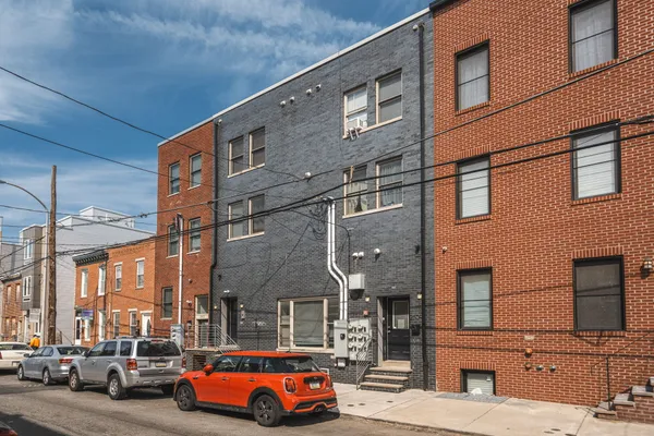 a view of a car park in front of a building