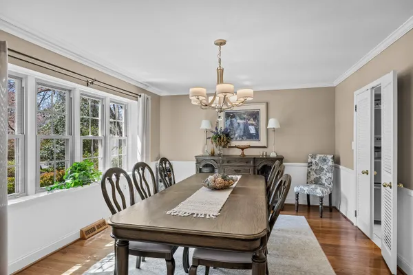a living room with furniture a rug and a table