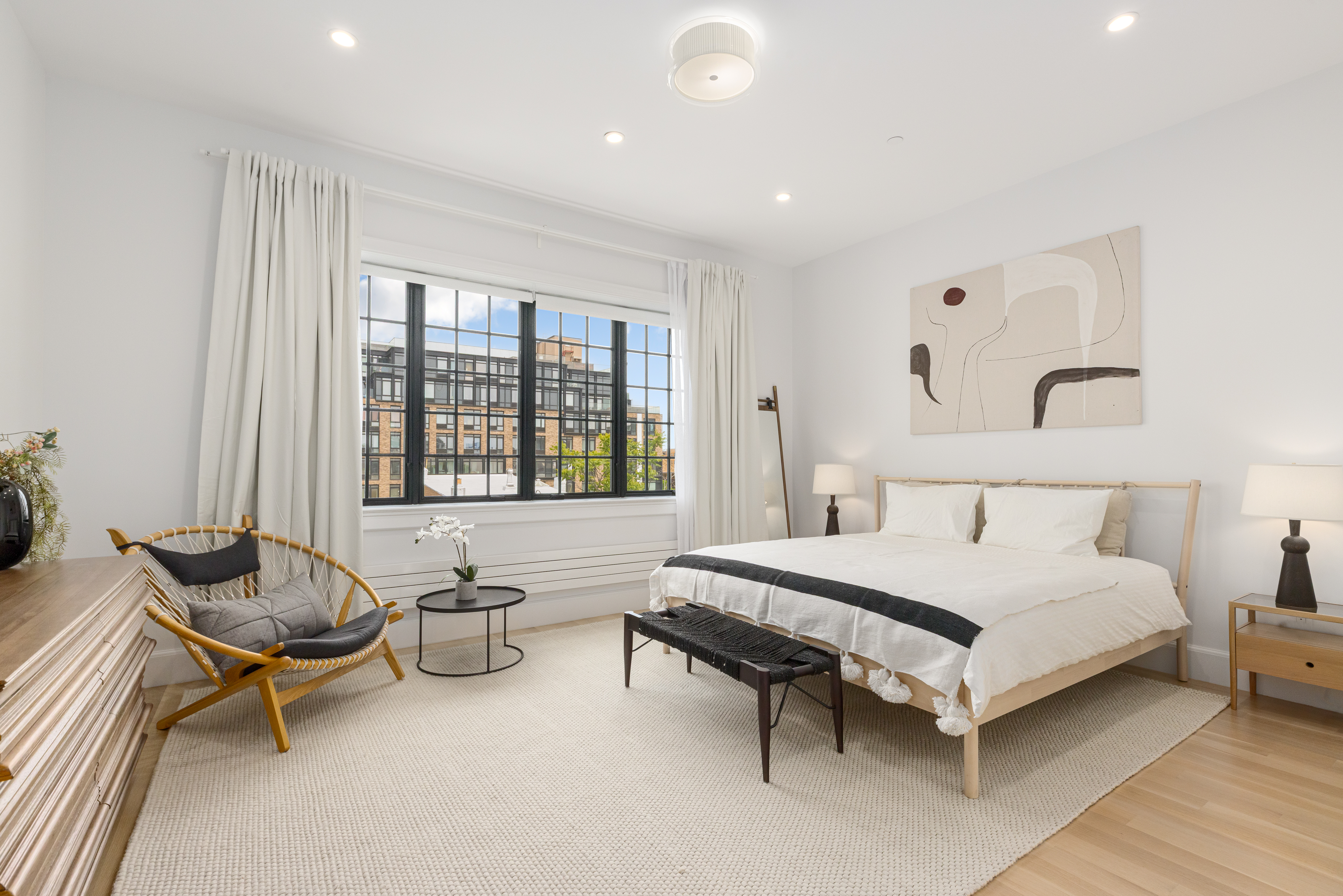 179 Devoe Street Brooklyn, NY 11211 - Photo 7 of 20 a bedroom with furniture and a large window