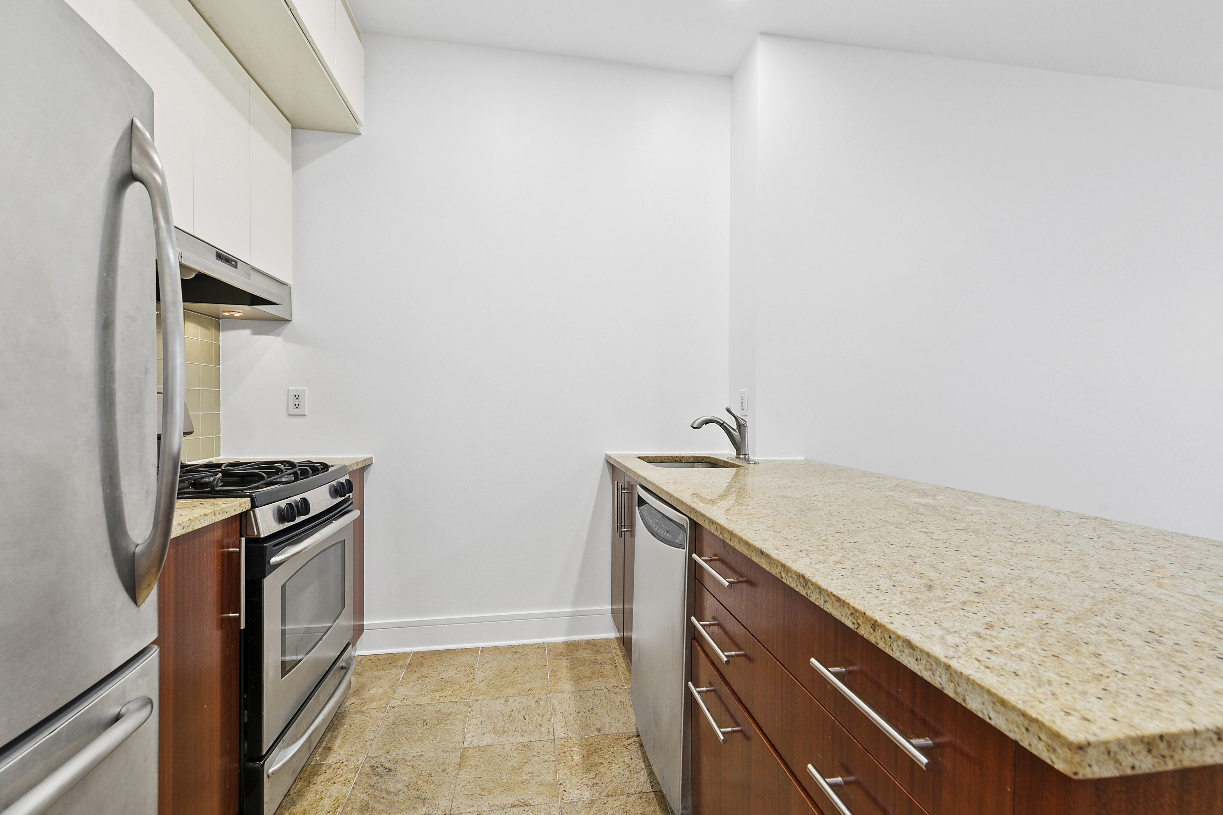 41-26 27th Street, Unit 4H Queens, NY 11101 - Photo 2 of 21 a kitchen with a stove and a sink