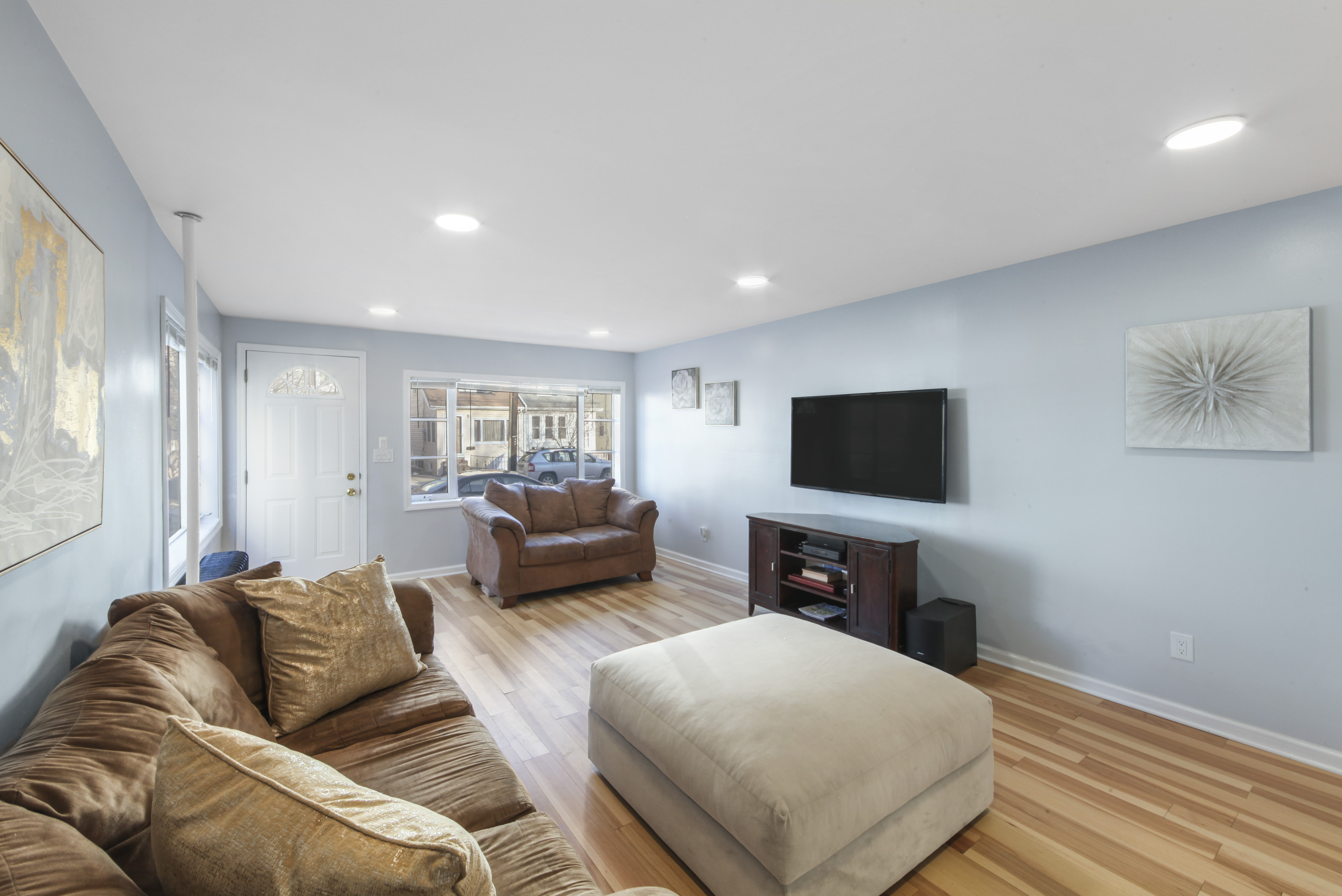 1530 East 51st Street Brooklyn, NY 11234 - Photo 10 of 14 a living room with furniture and a flat screen tv