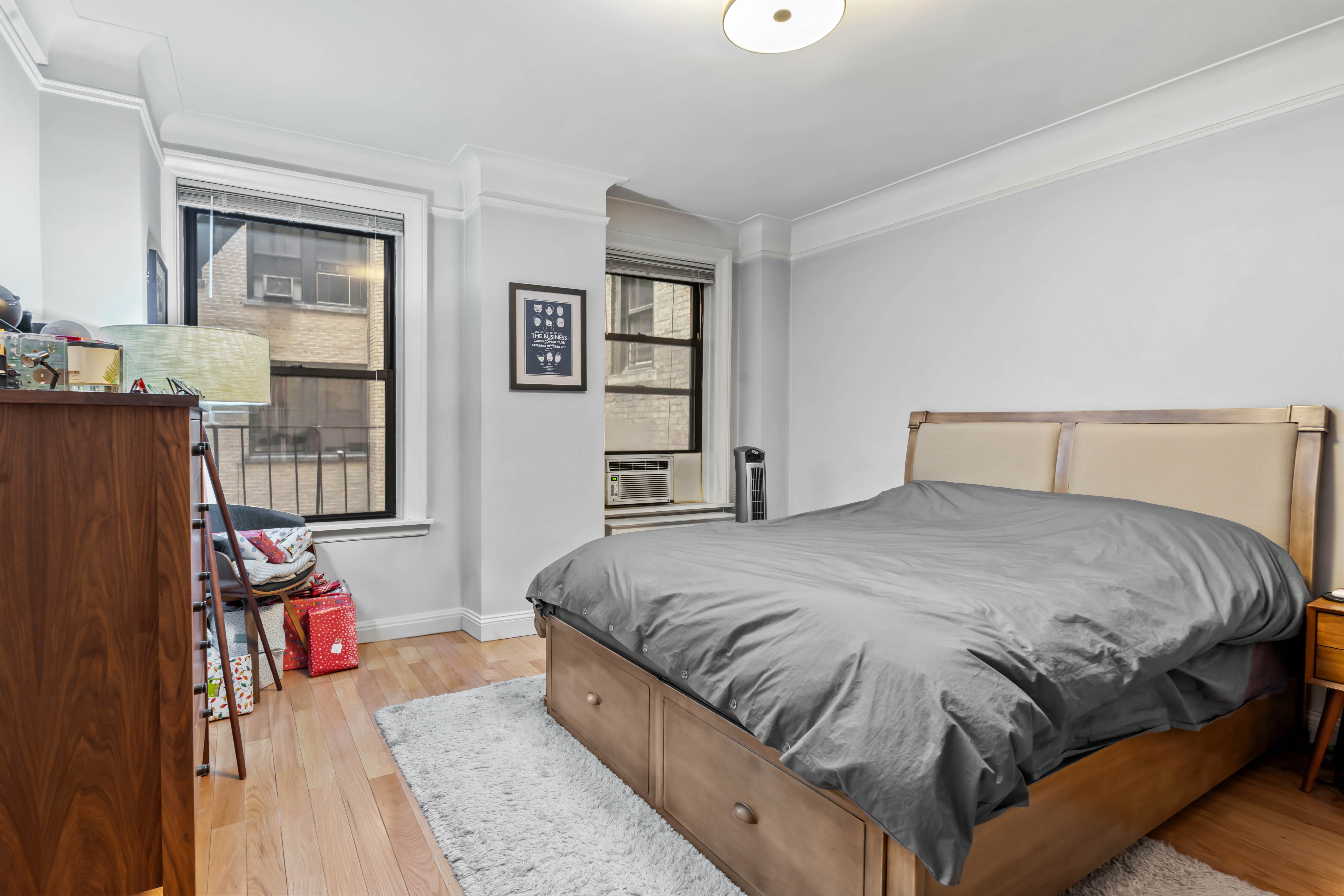 467 Central Park West, Unit 2G Manhattan, NY 10025 - Photo 6 of 10 a bedroom with a bed and wooden floor