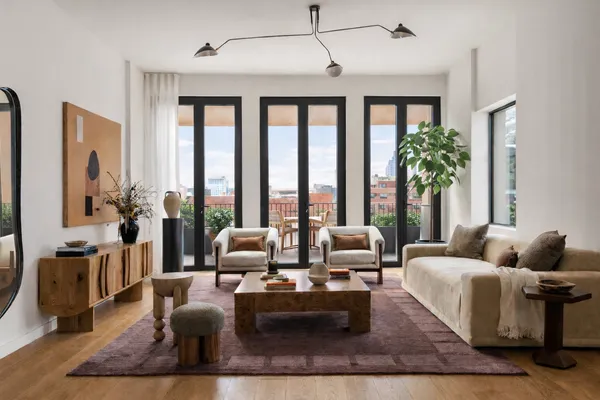 a living room with furniture large window and flat screen tv