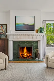 a living room with a fireplace and a fireplace
