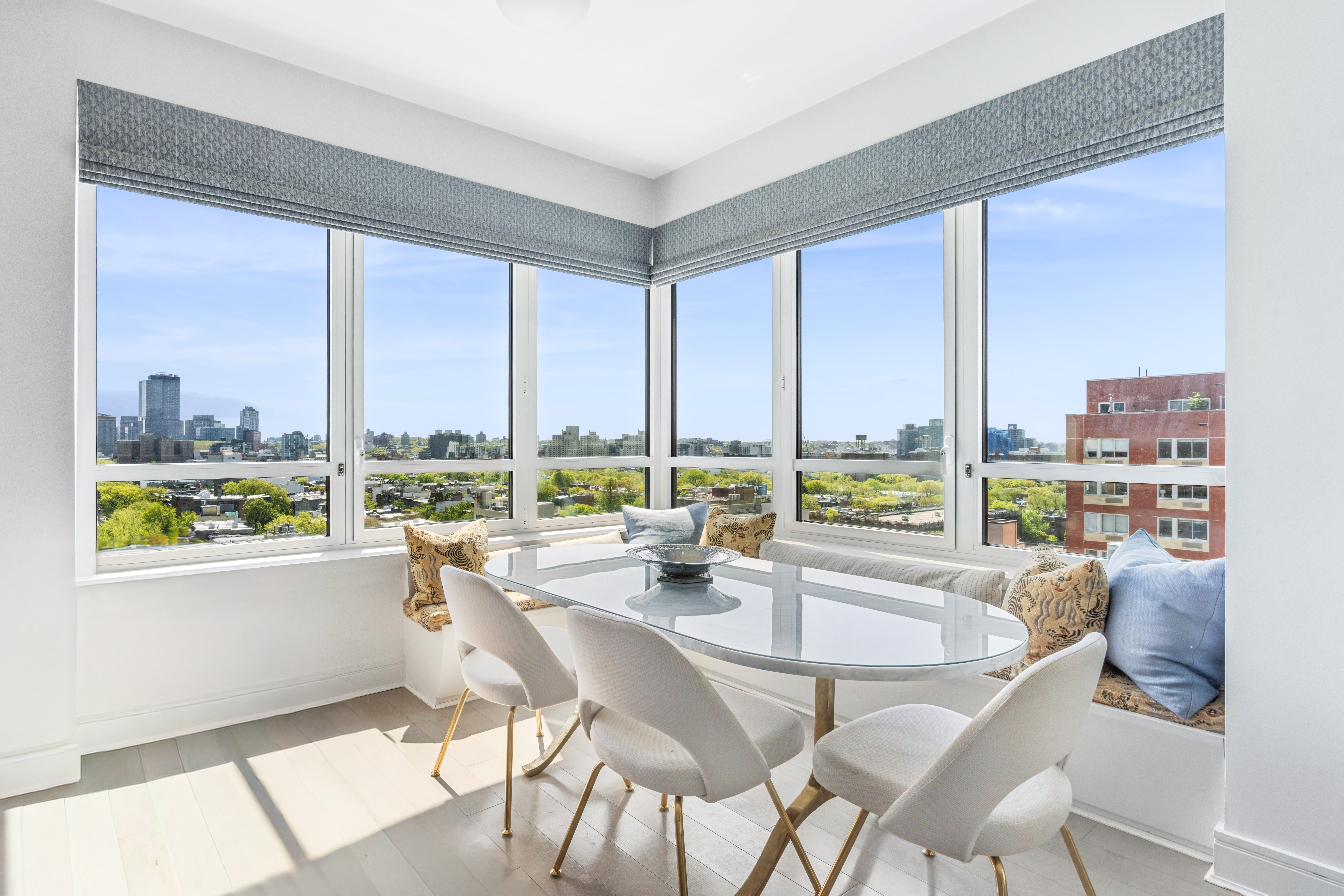 265 State Street, Unit 1201 Brooklyn, NY 11201 - Photo 3 of 19 a dining room with furniture a window and a kitchen view