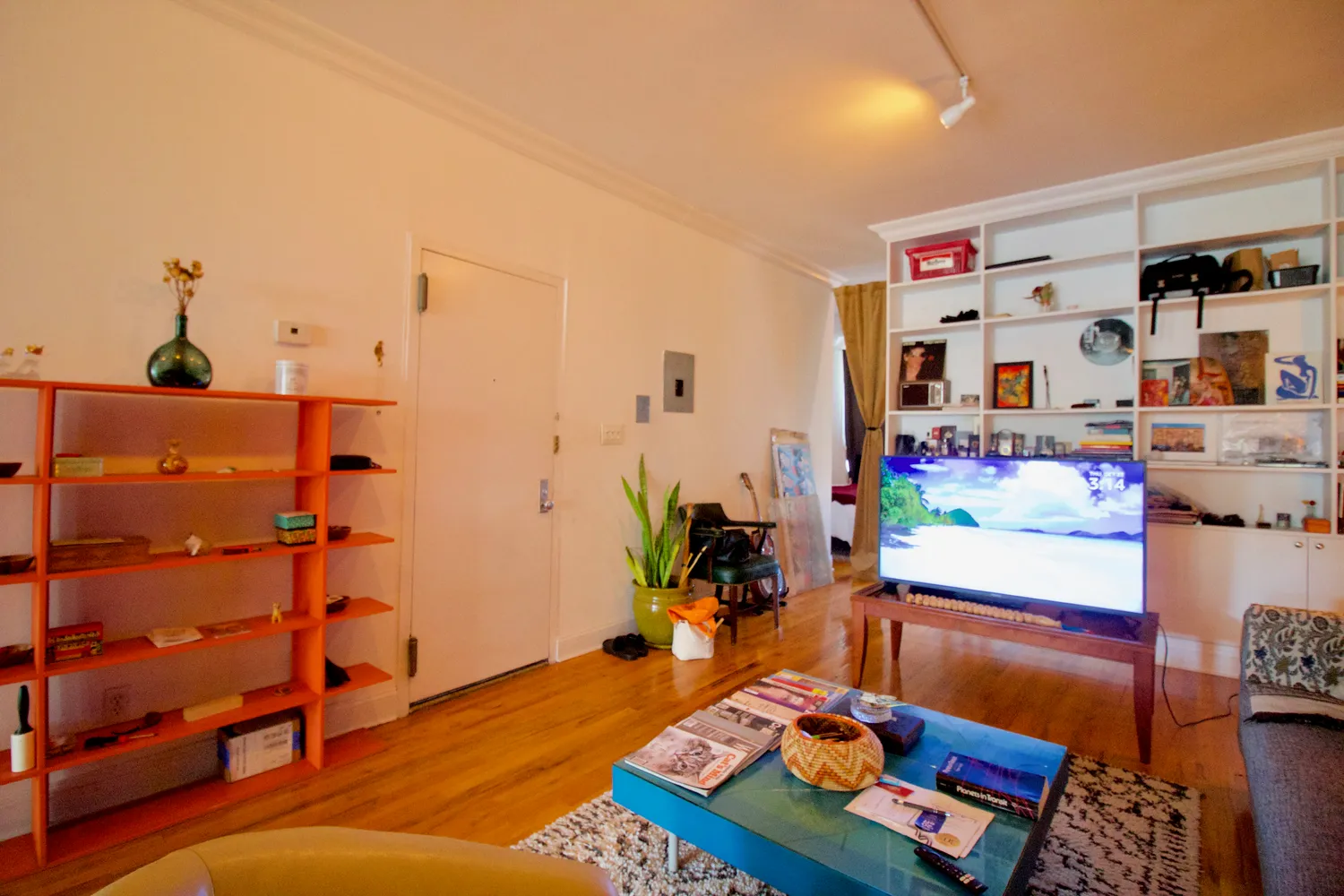 a room with furniture and wooden floor