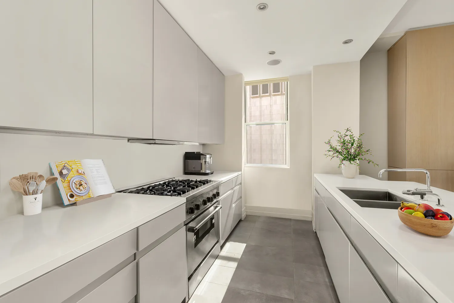 a kitchen that has a sink and a stove