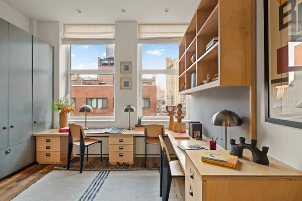 a workspace with furniture and window