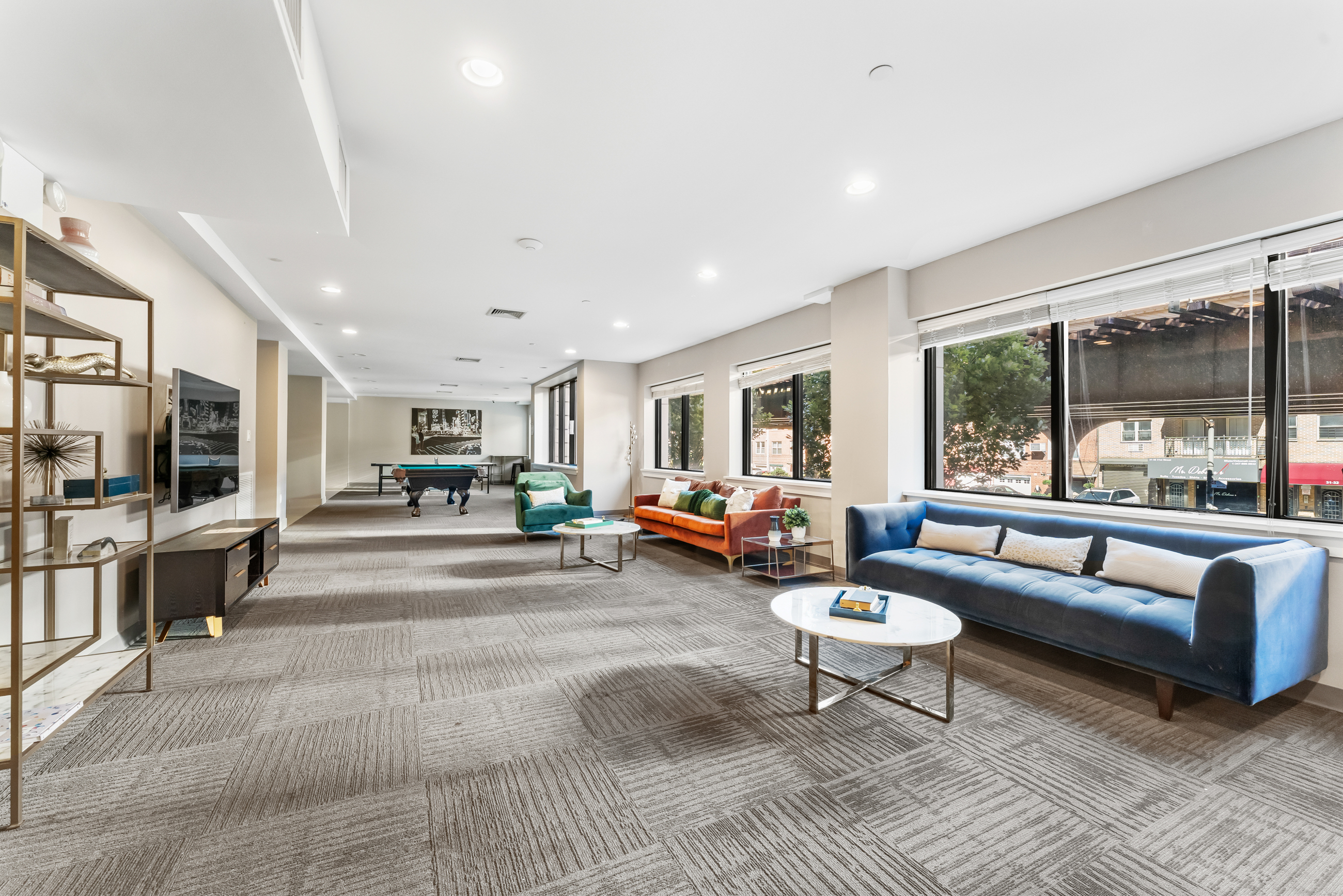 31-35 31st Street, Unit 512 Queens, NY 11106 - Photo 6 of 6 a living room with furniture and a large window