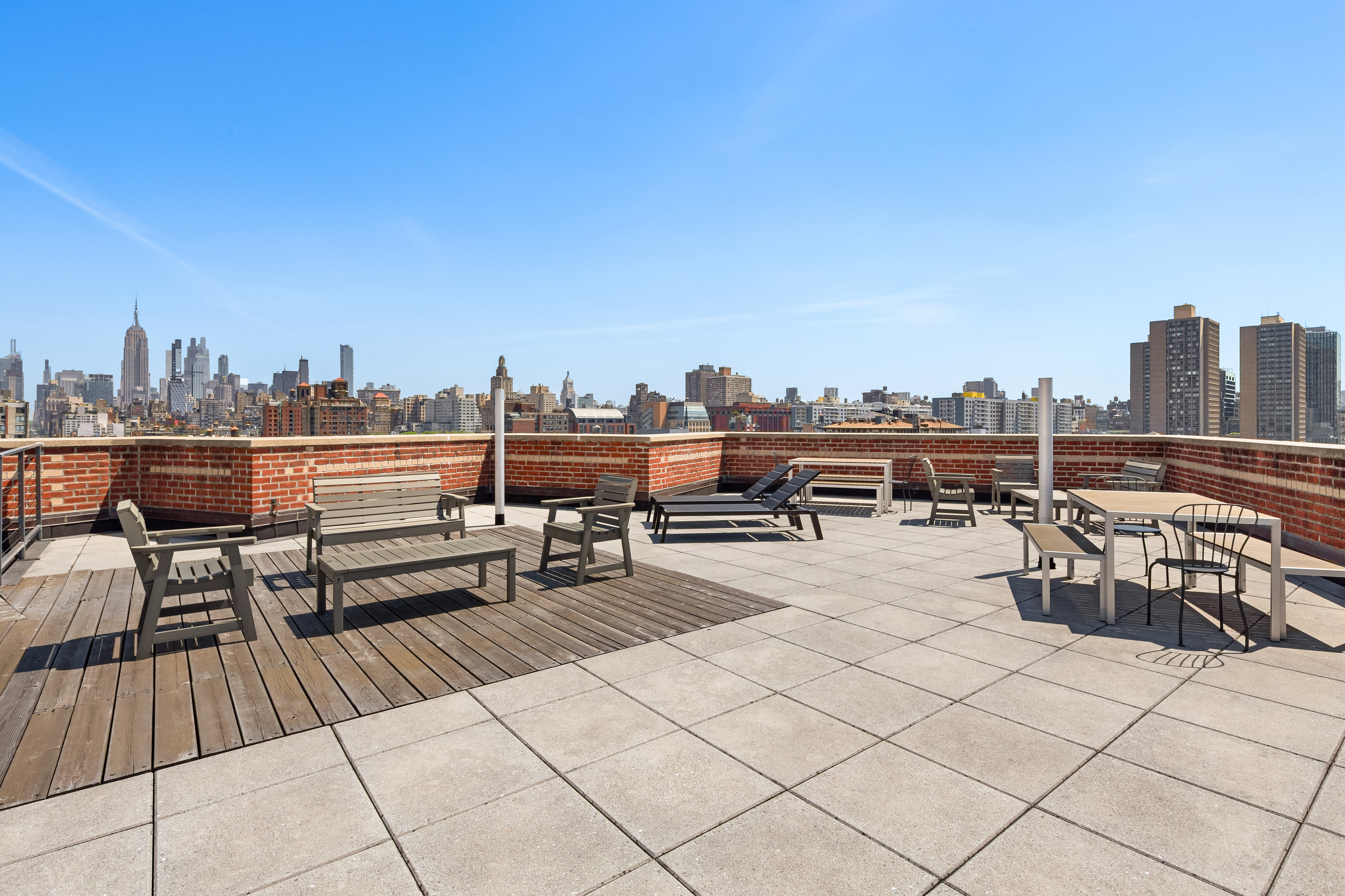 180 West Houston Street, Unit 2E Manhattan, NY 10014 - Photo 6 of 7 a view of roof deck with seating space and trees