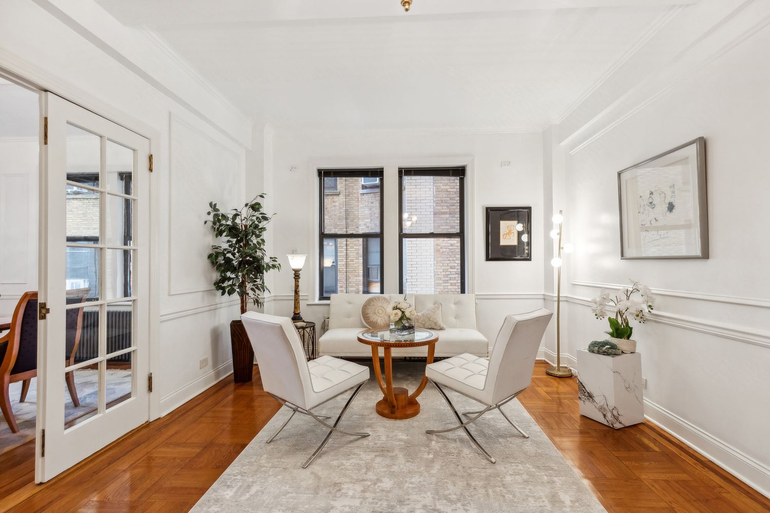 a living room with furniture and next to a window