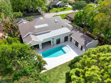 an aerial view of a house with a garden