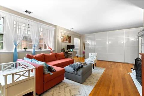 a living room with furniture and a table