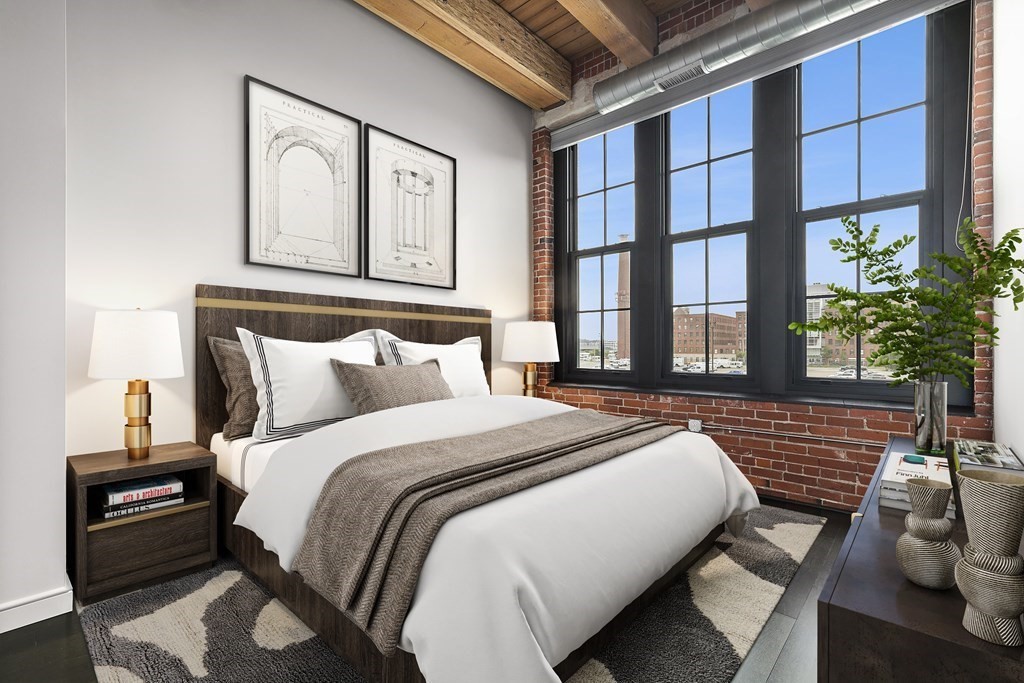 319 A Street, Unit 211 Boston, MA 02210 - Photo 9 of 24 a bedroom with a bed and a window