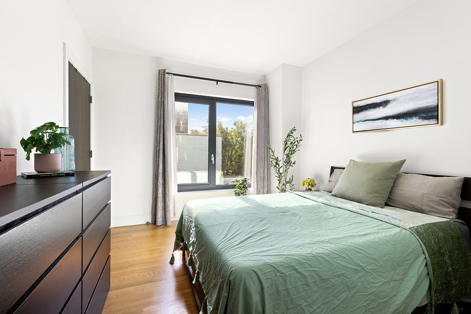 554 4th Avenue, Unit 4D Brooklyn, NY 11215 - Photo 6 of 11 a bedroom with a bed and wooden floor