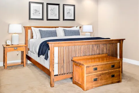a bedroom with a bed and window