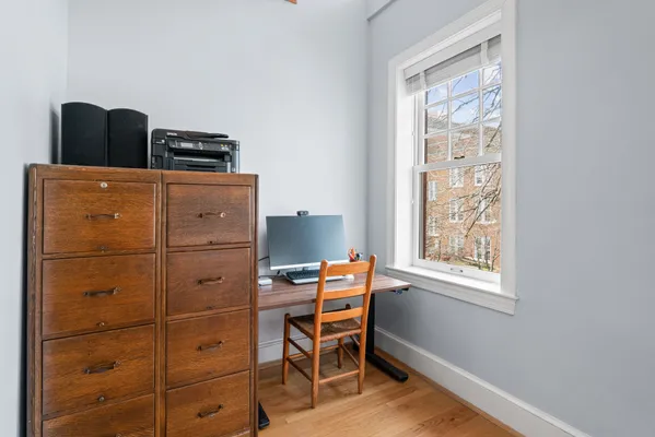 a room with a chair and a window