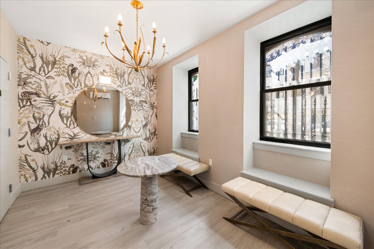 463 West 142nd Street, Unit 4B Manhattan, NY 10031 - Photo 8 of 10 a living room with furniture and a window