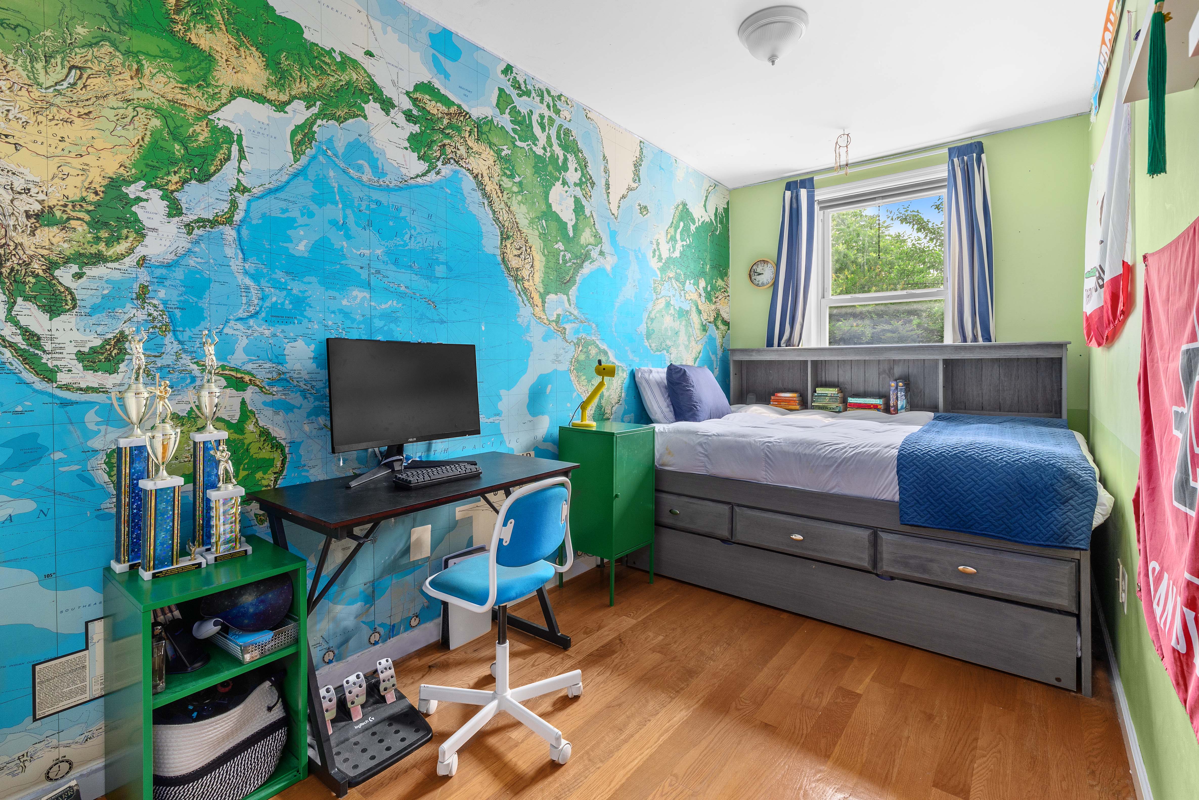 266 18th Street Brooklyn, NY 11215 - Photo 8 of 20 a bedroom with furniture and a flat screen tv