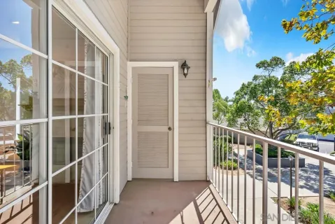 a kitchen with stainless steel appliances granite countertop a stove a refrigerator and a white cabinets