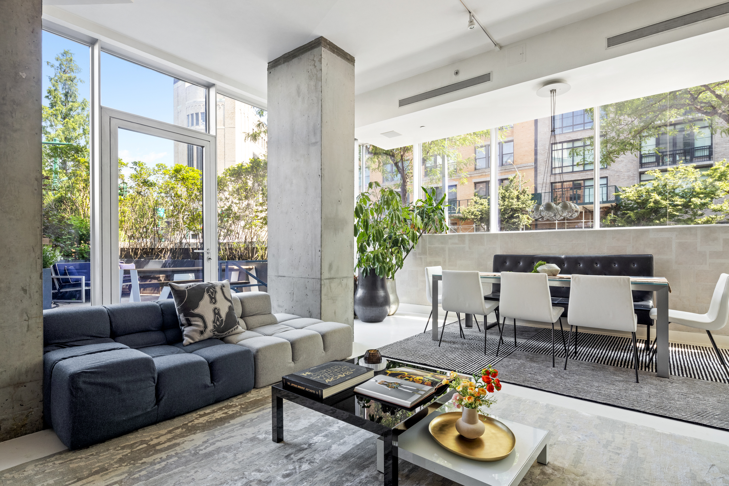 471 Washington Street, Unit 1B Manhattan, NY 10013 - Photo 4 of 17 a living room with furniture and a floor to ceiling window