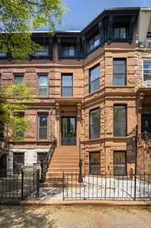 a front view of a house with glass windows