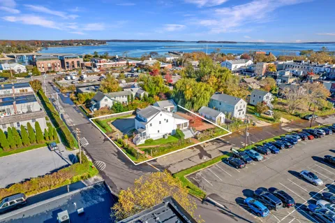 an aerial view of a balcony with chairs