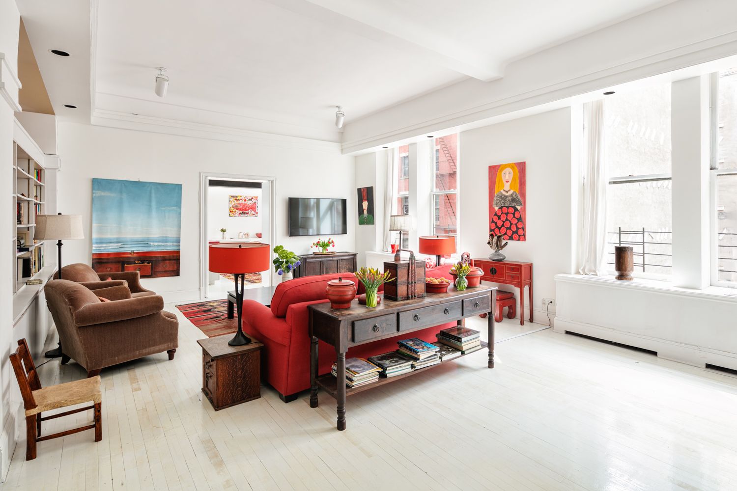366 Broadway, Unit 3C Manhattan, NY 10013 - Photo 2 of 10 a living room with furniture and a window