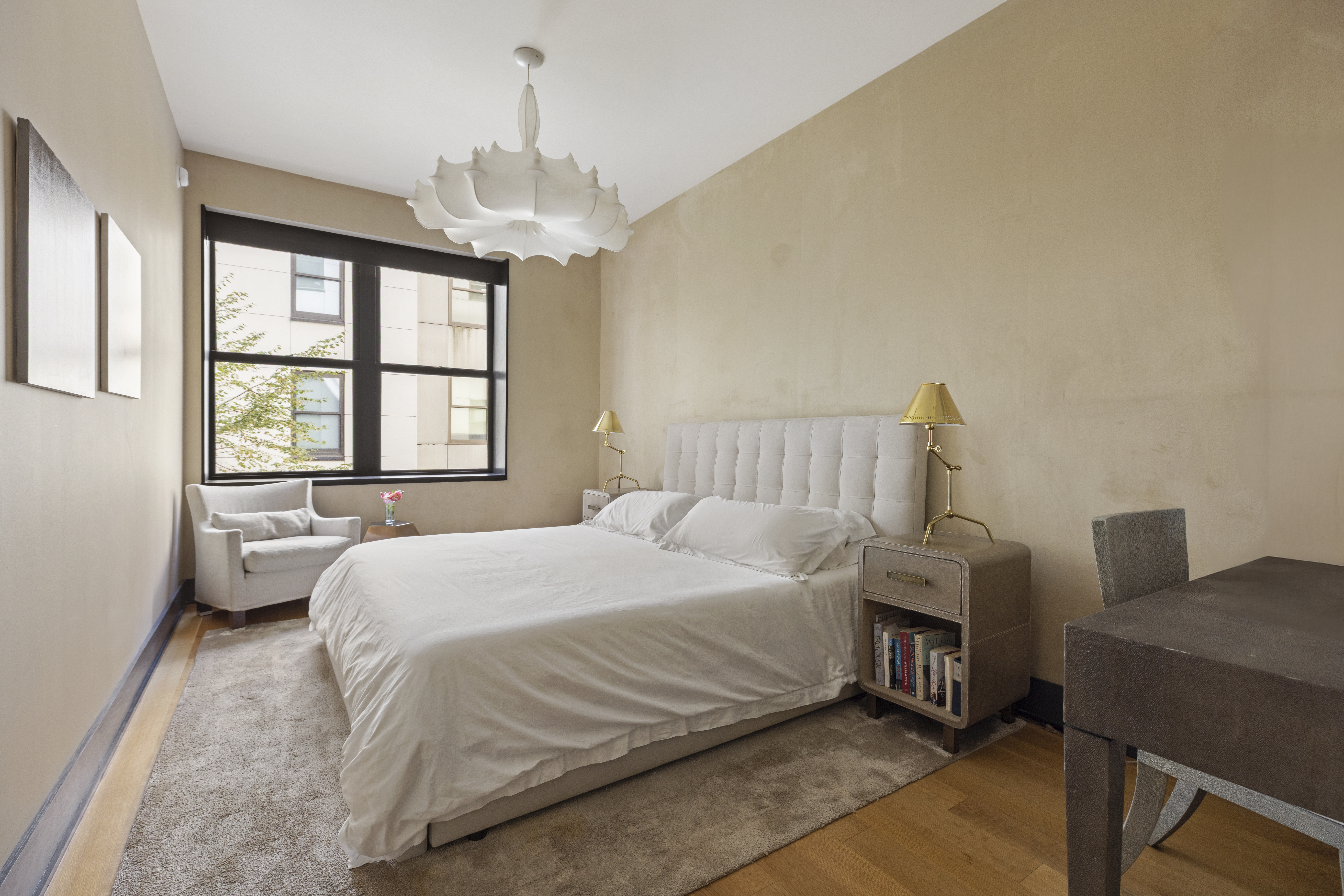 71 Reade Street, Unit 5A Manhattan, NY 10007 - Photo 15 of 27 a bedroom with a bed and a chandelier