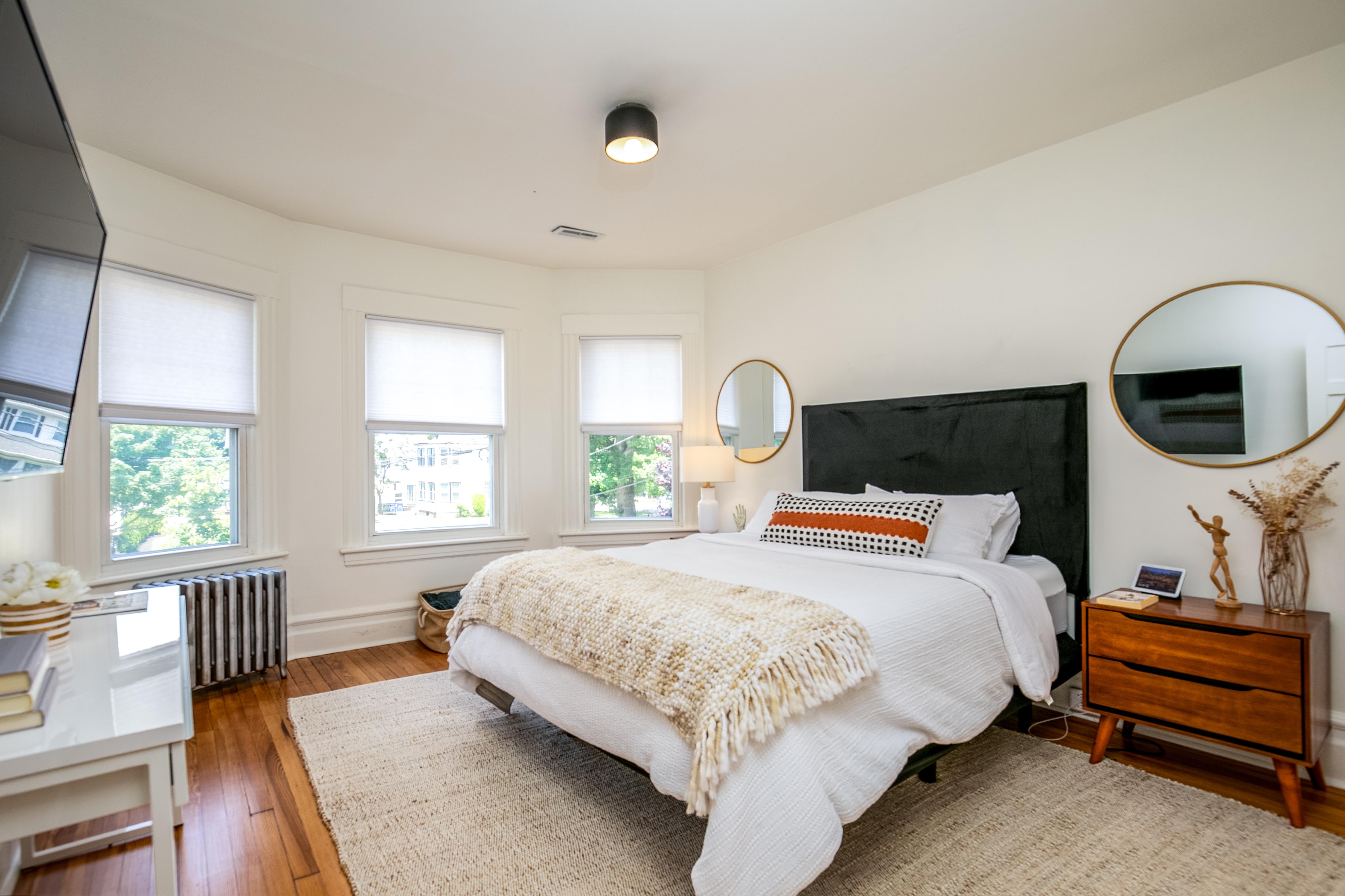 163 Ridge Road Rutherford, NJ 07070 - Photo 29 of 59 a bedroom with a large bed and a window