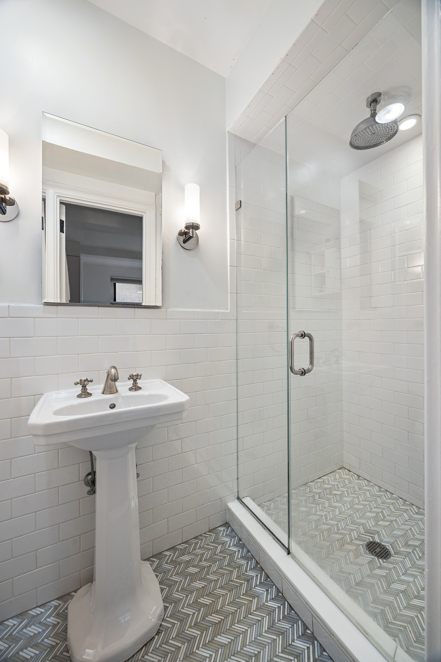 325 East 79th Street, Unit 6C Manhattan, NY 10075 - Photo 11 of 17 a bathroom with a sink toilet and shower