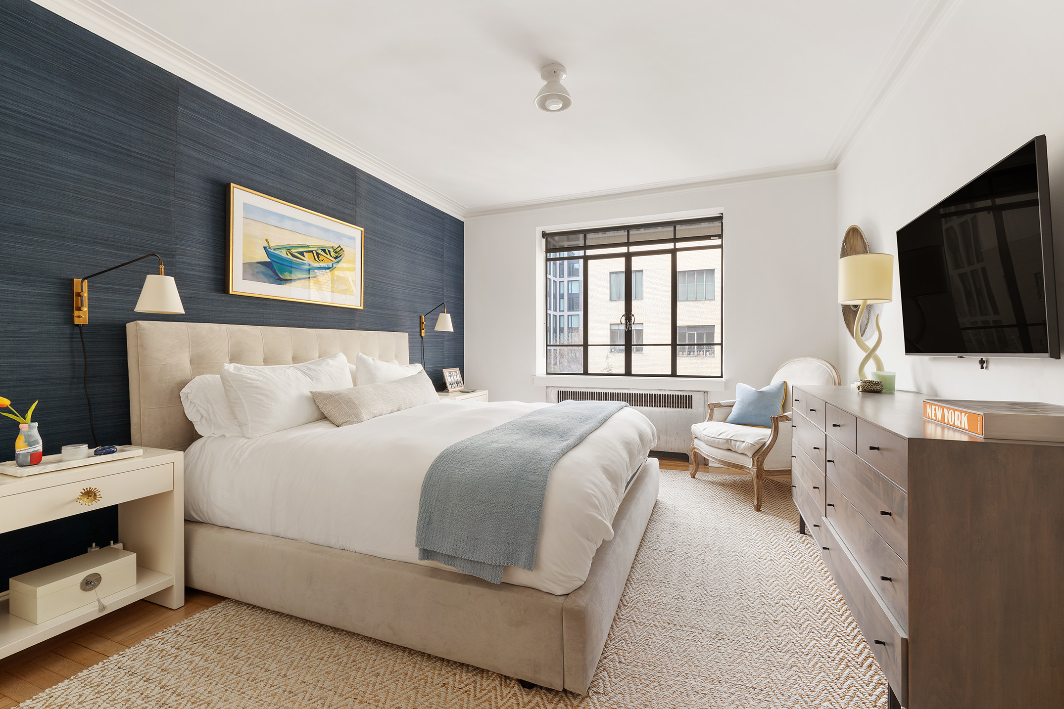 250 West 24th Street, Unit 6/5CE Manhattan, NY 10011 - Photo 6 of 11 a bedroom with bed tv and window