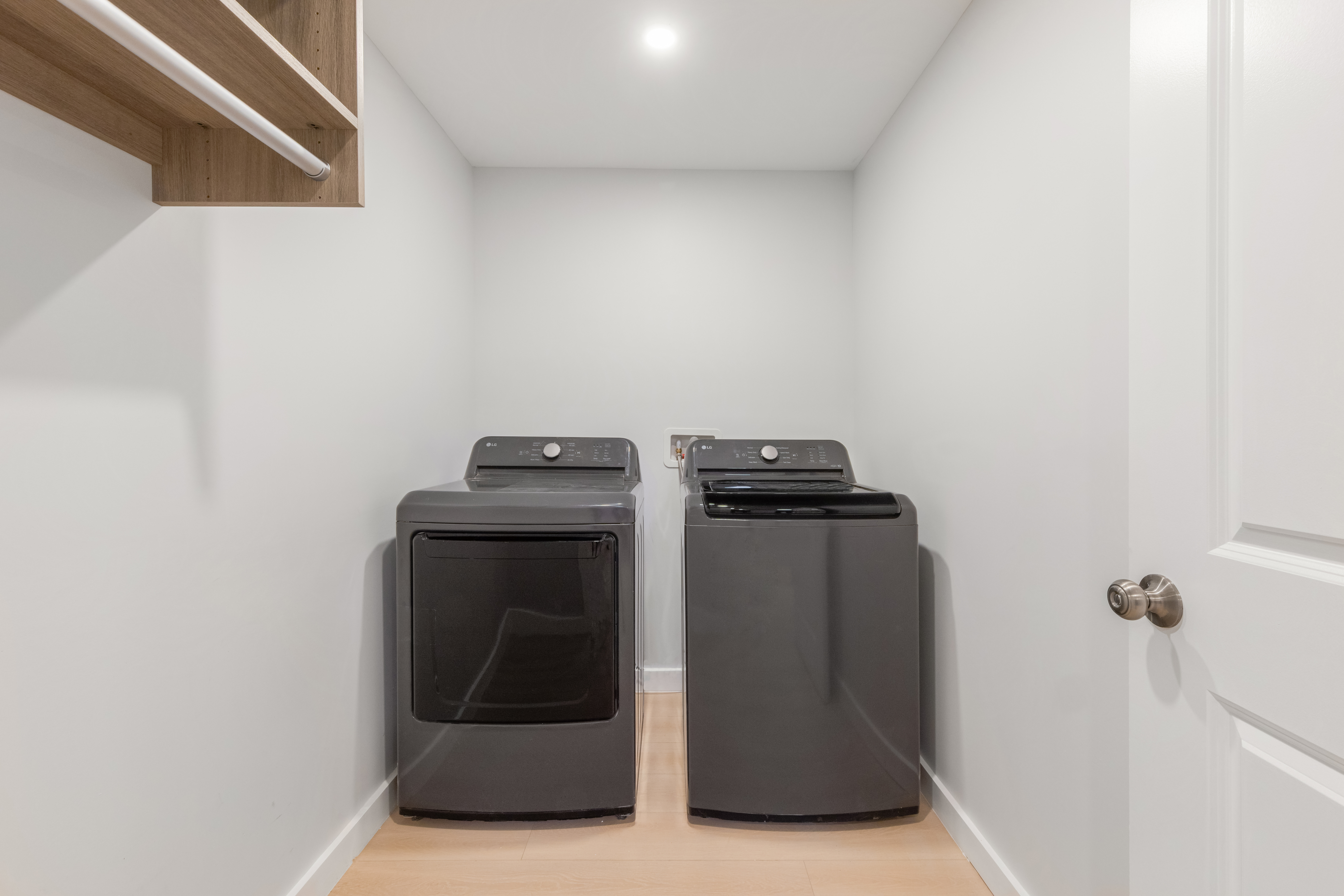 227 East 21st Street, Unit 2R Manhattan, NY 10010 - Photo 10 of 12 a utility room with wooden floor
