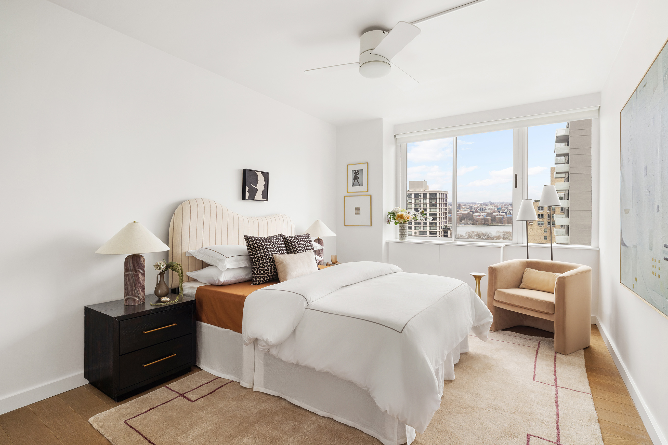 455 East 86th Street, Unit 20E Manhattan, NY 10028 - Photo 12 of 14 a large bedroom with a bed and large window