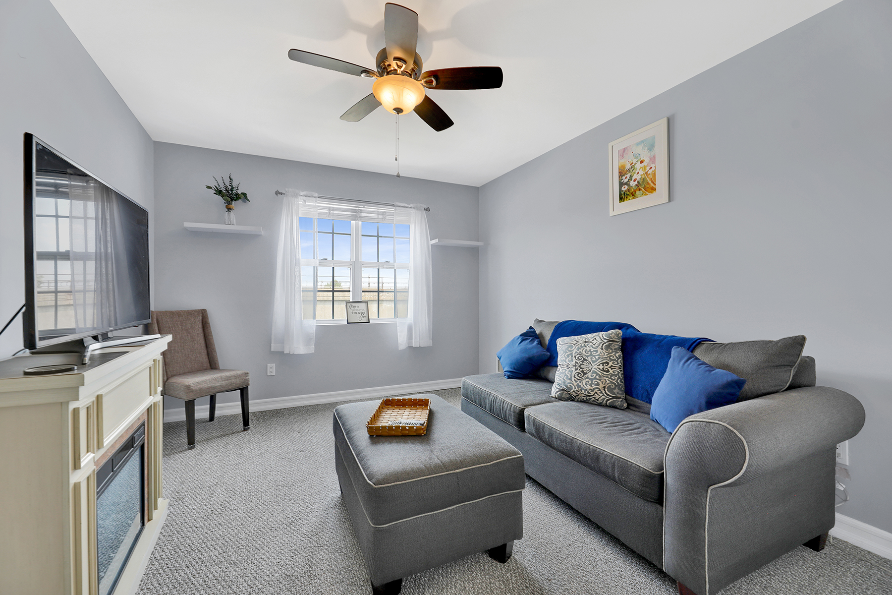 102-20 Rockaway Beach Boulevard, Unit 3C Queens, NY 11694 - Photo 20 of 36 a living room with furniture and a flat screen tv