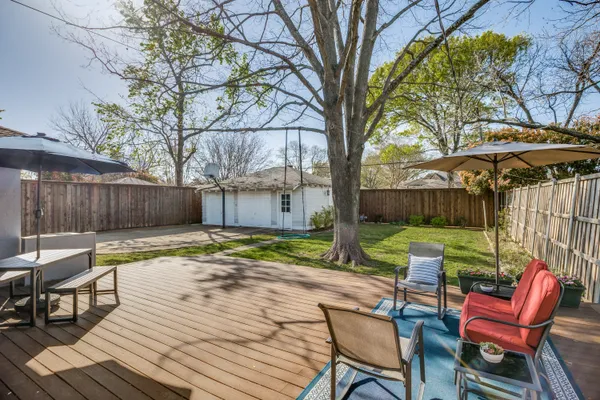 a view of a table and chairs in the patio