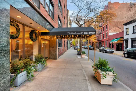 a building with potted plants in front of it