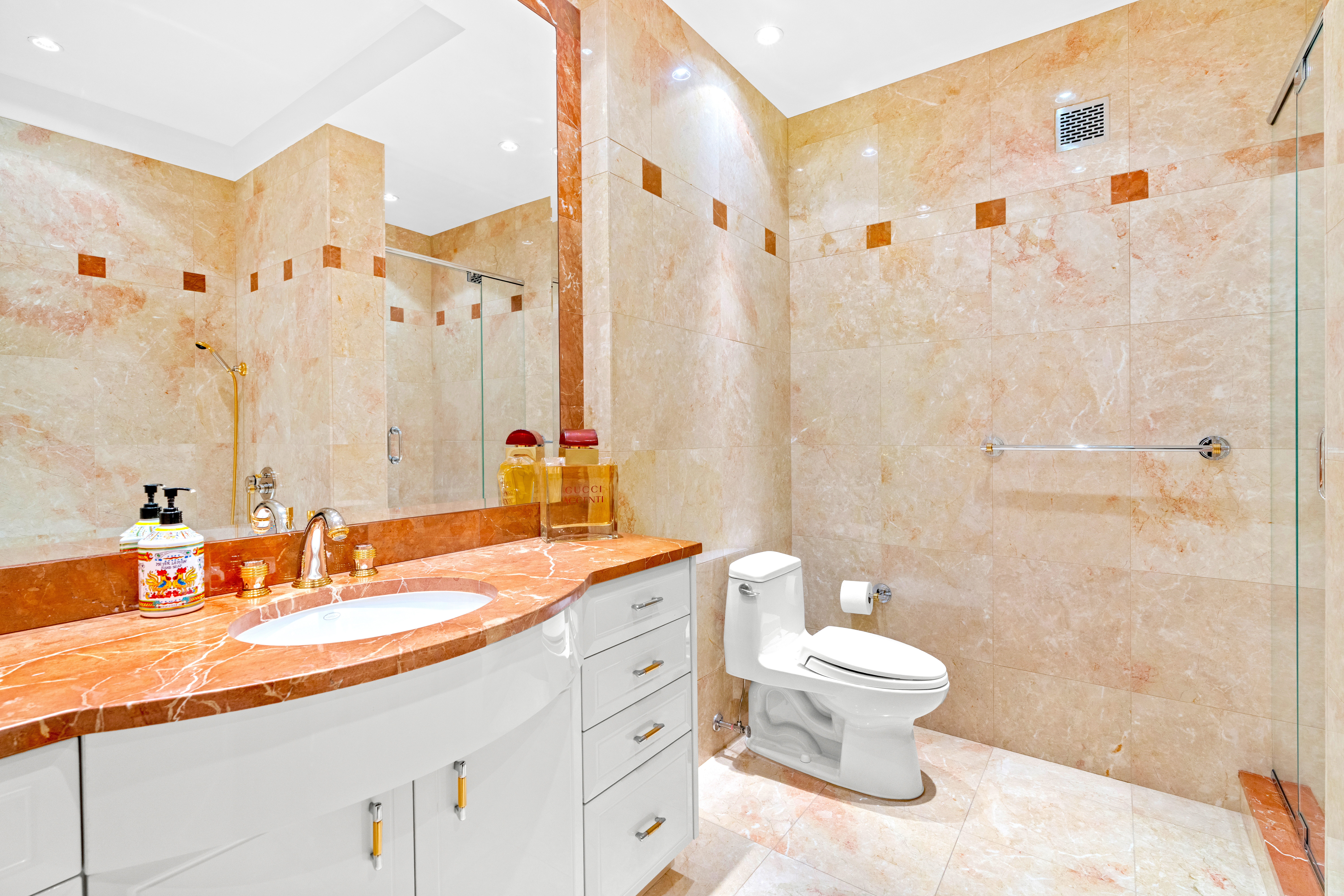 1965 Broadway, Unit 26EF Manhattan, NY 10023 - Photo 26 of 32 a bathroom with a double vanity sink toilet and shower