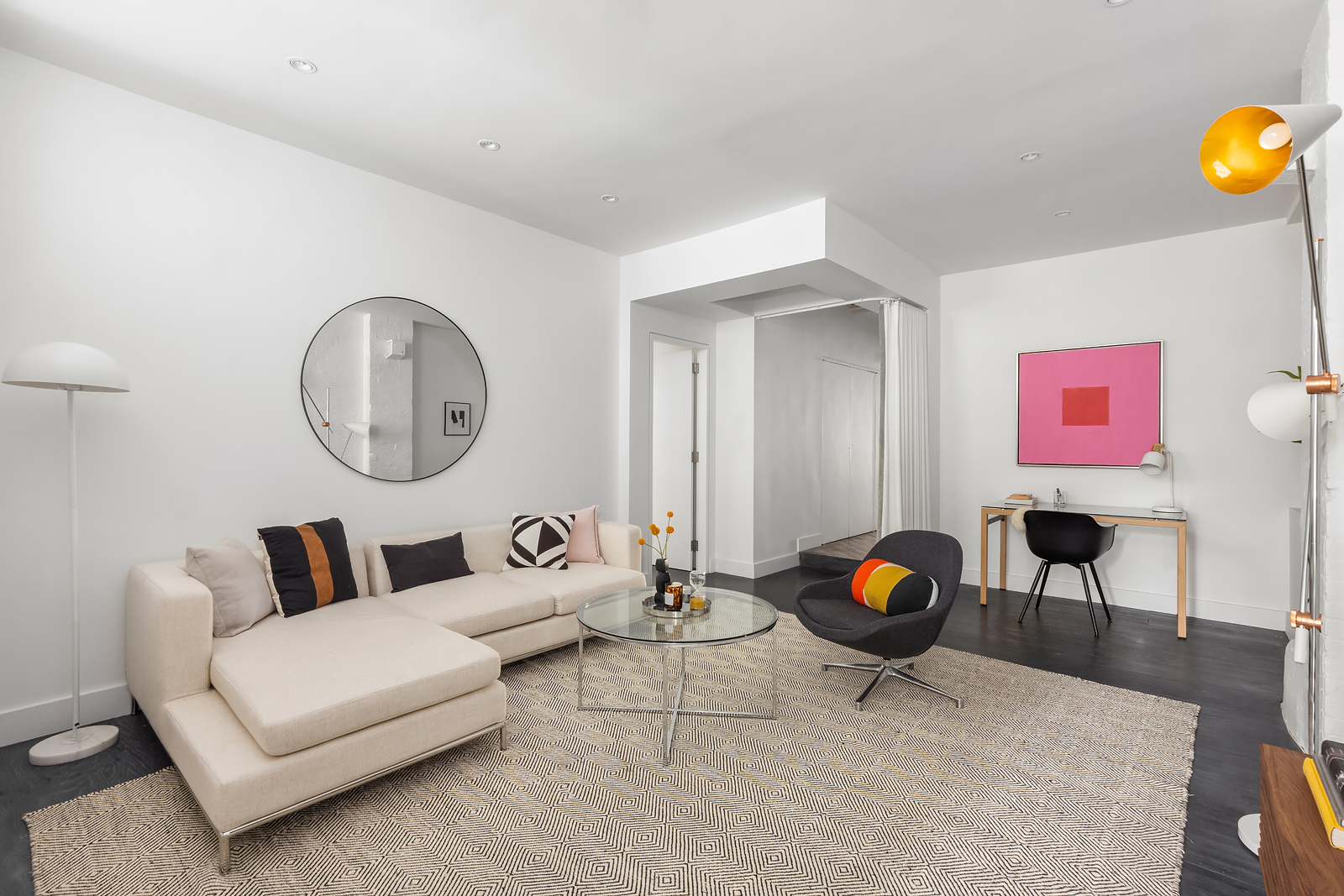 36 West 15th Street, Unit 4 Manhattan, NY 10011 - Photo 11 of 21 a living room with furniture and a wooden floor